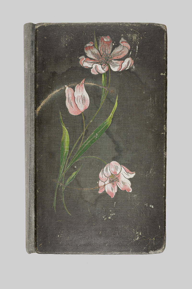 Front cover of postcard album after final treatment